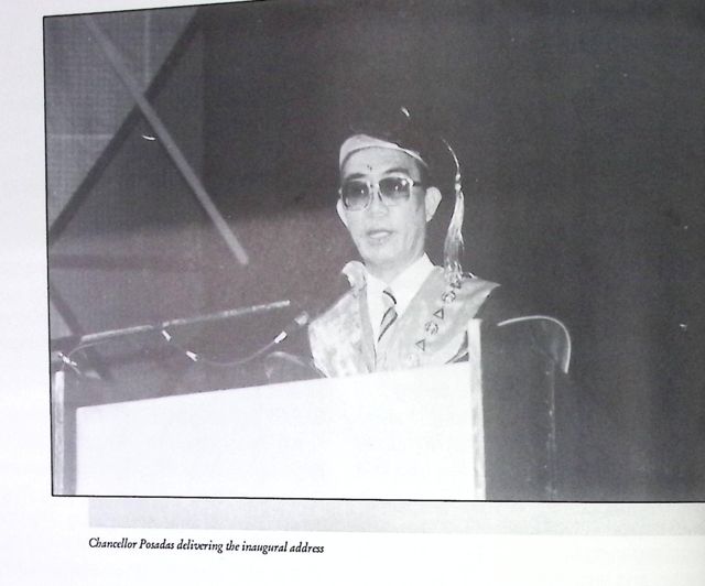 Chancellor Posadas in academic regalia delivering his inaugural address at a podium