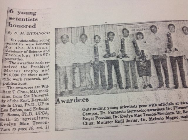 Newspaper clipping headlined 6 young scientists honored, with a photograph of the awardees holding trophies at the National Academy of Science and Technology; the caption lists Dr. Roger Posadas