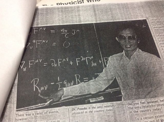 Magazine photograph of Roger Posadas in a barong at a blackboard covered with the equations of electromagnetism and general relativity